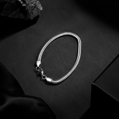 Niéche Snake Chain Bracelet flat lay on black background