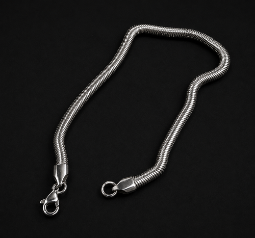 Niéche Snake Chain Bracelet flat lay, S-curve